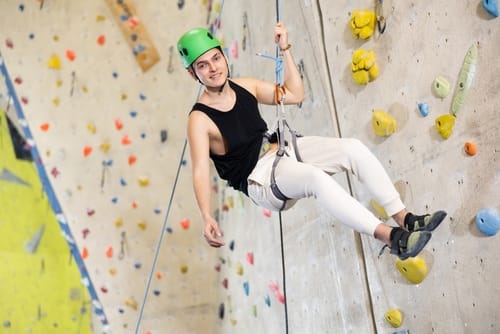 Man absailing after a climbing wall