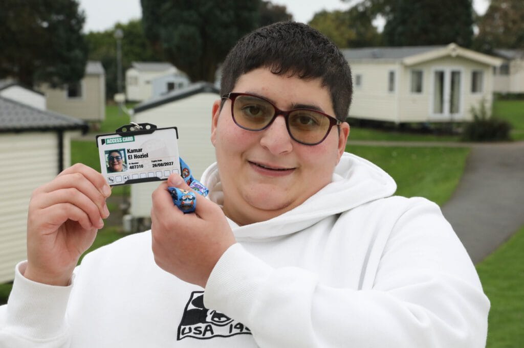 Picture of Kamar holding the Access Card at Hafan y Mor, Pwllheli